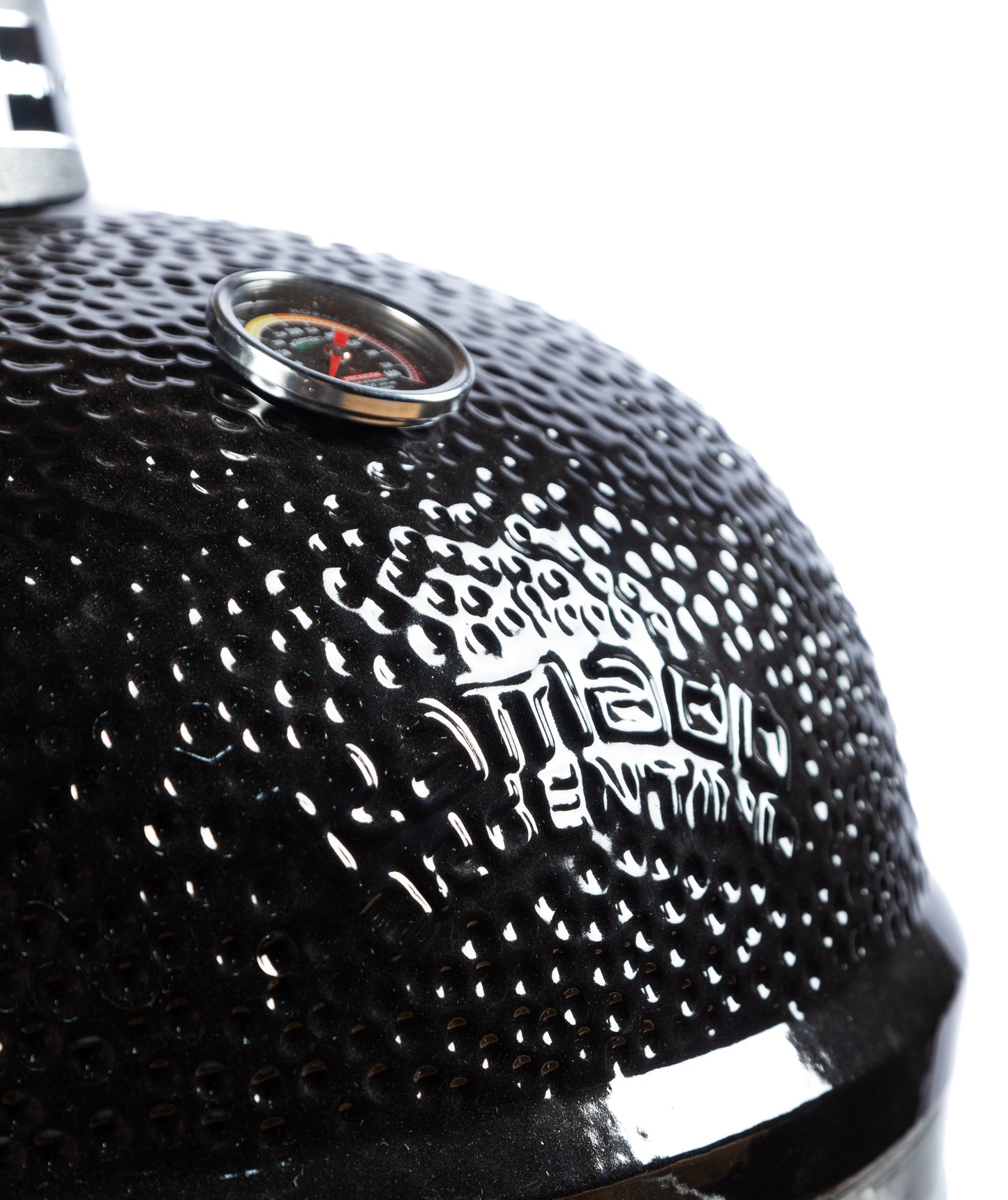 Closeup of the Kamado Argentino Big Gaucho Grill Black showcasing the ceramic grill brand name.